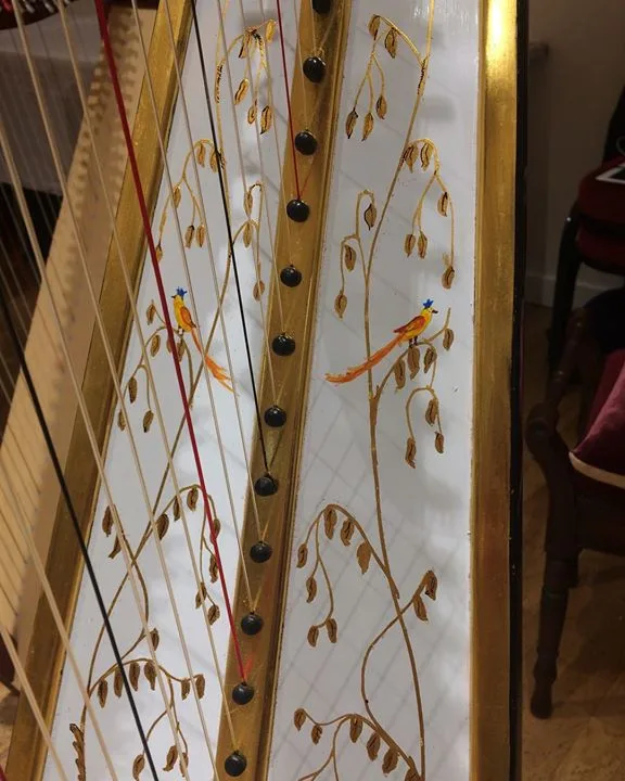 Hand-decorated harp soundboard with gold leaf detailing