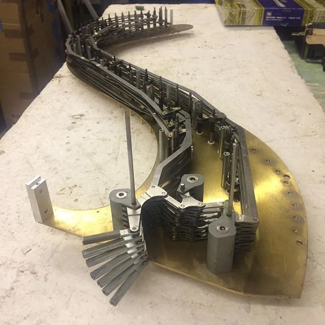 Harp mechanism laid out for detailed workshop servicing
